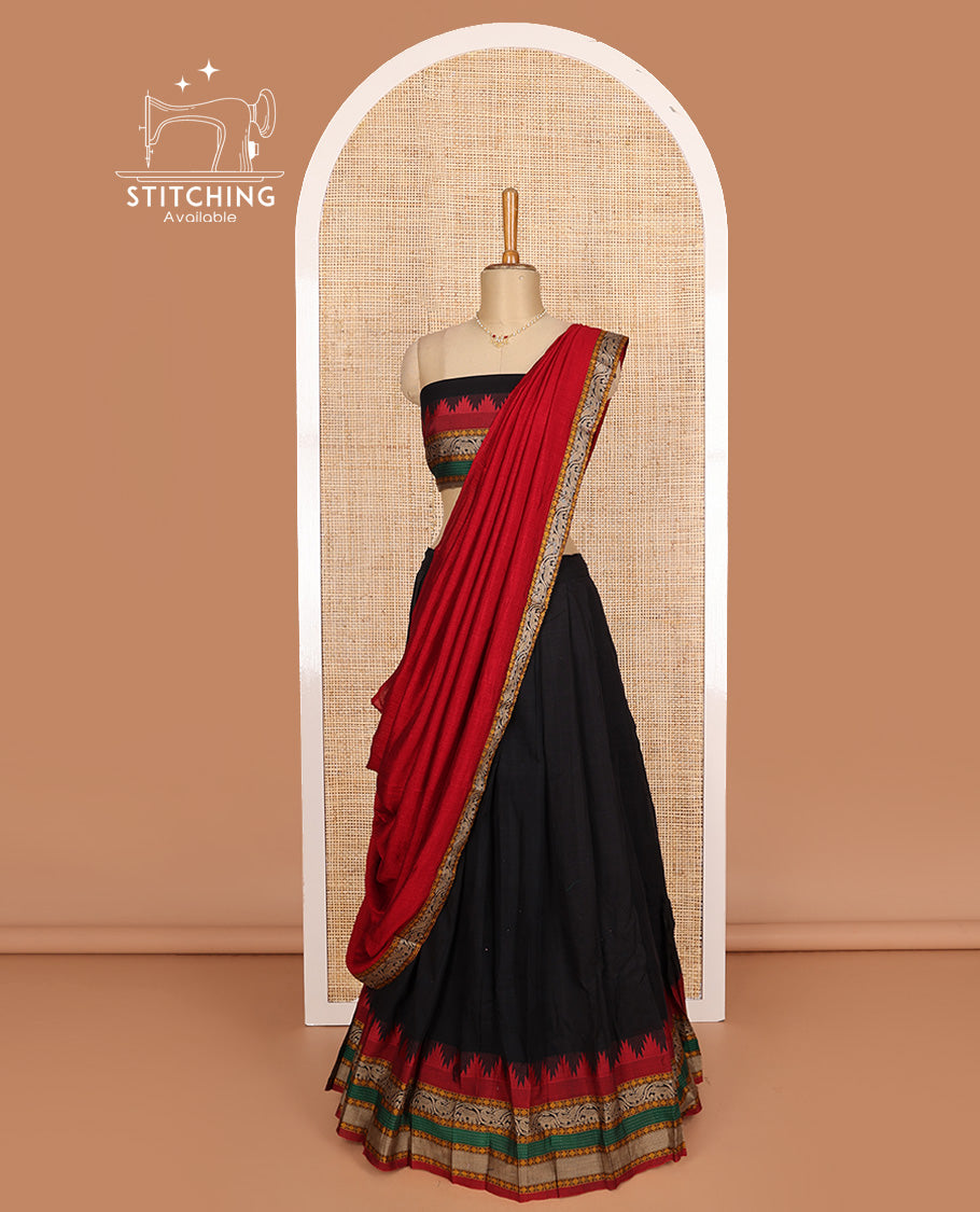 Black cotton half-saree, plain with contrast traditional motif bordered skirt, matching blouse, and contrast elephant motif dhavani