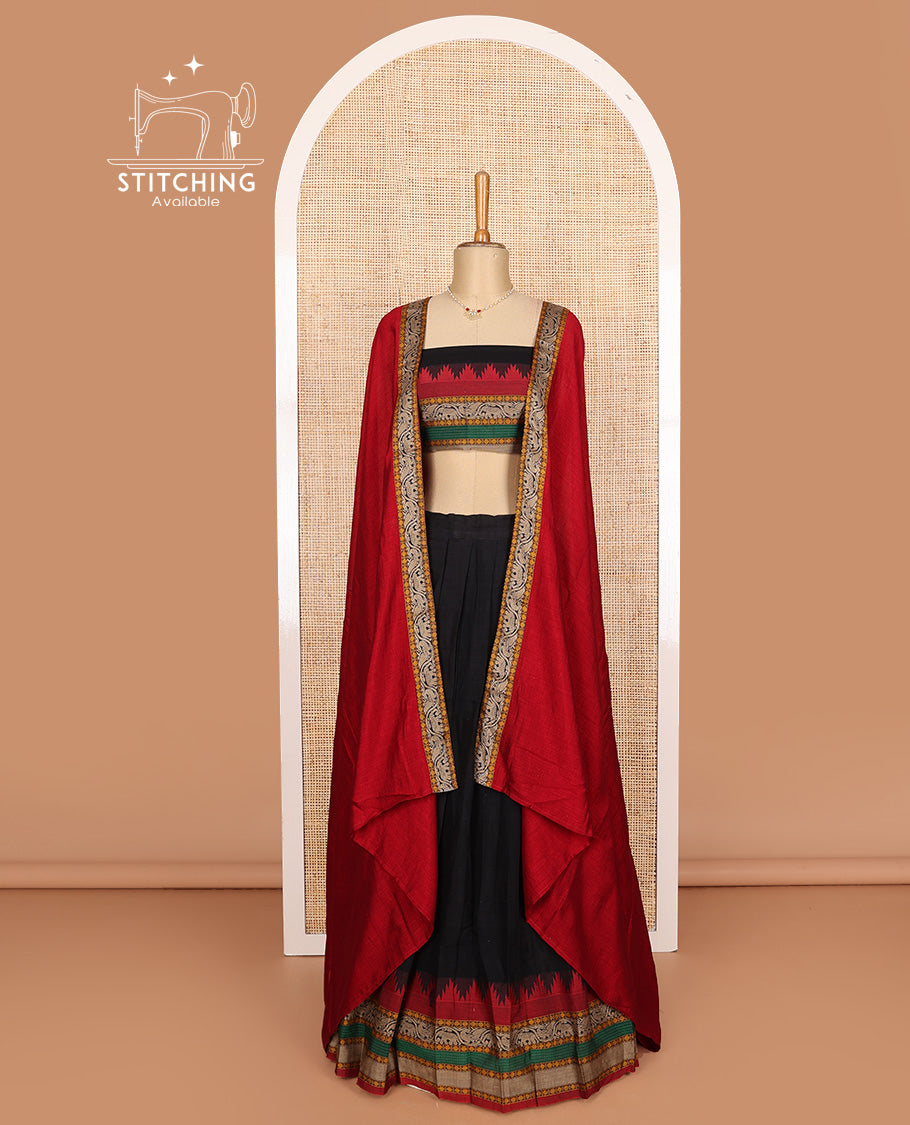 Black cotton half-saree, plain with contrast traditional motif bordered skirt, matching blouse, and contrast elephant motif dhavani