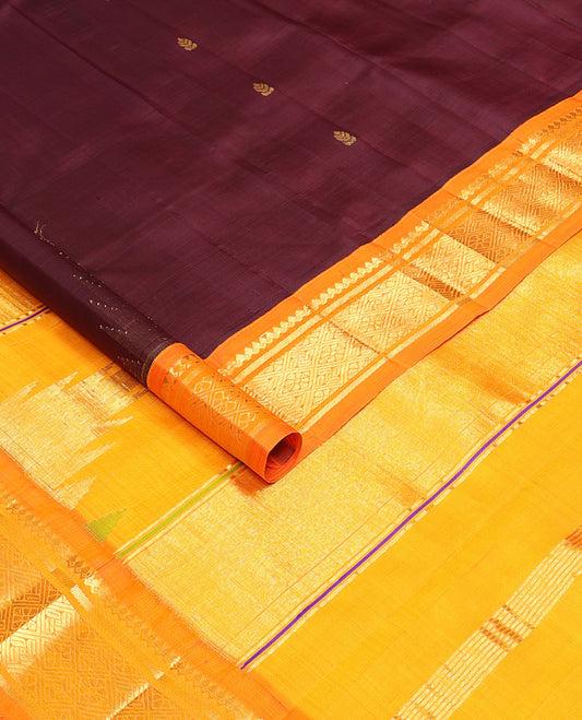 Maroon buttas Kanchipuram silksaree, contrast one-sided zari korvai border of salngai & jaal design & thazampoo rekku pallu