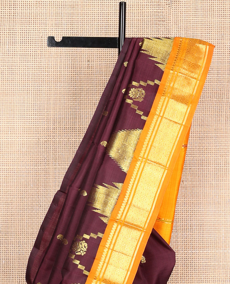 Maroon buttas Kanchipuram silksaree, contrast one-sided zari korvai border of salngai & jaal design & thazampoo rekku pallu