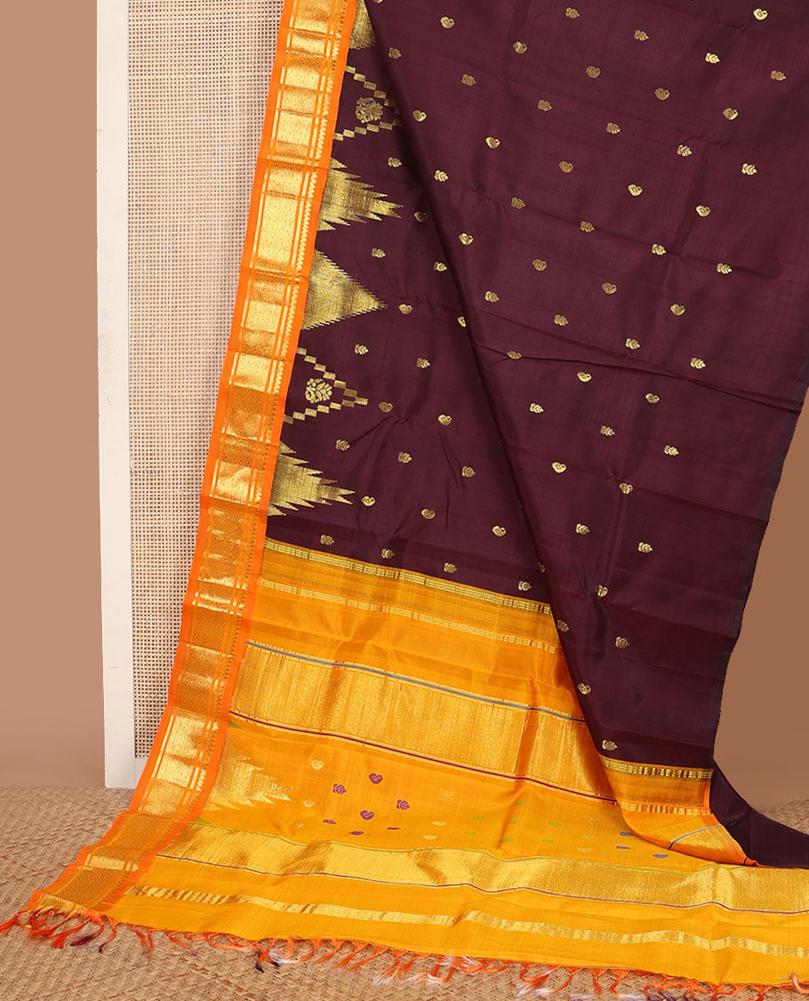 Maroon buttas Kanchipuram silksaree, contrast one-sided zari korvai border of salngai & jaal design & thazampoo rekku pallu