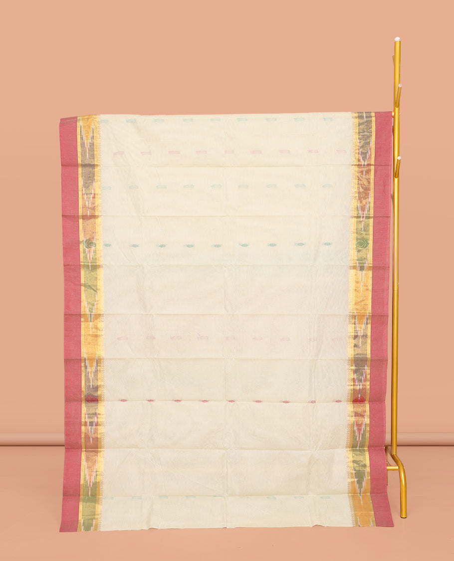 Off-White Kanchi Cotton Saree, Showcasing Buttas All Over Its Body, Complemented by a Contrast Ikkat Border, Pallu of Floral Designs, and Paired with a Matching Blouse