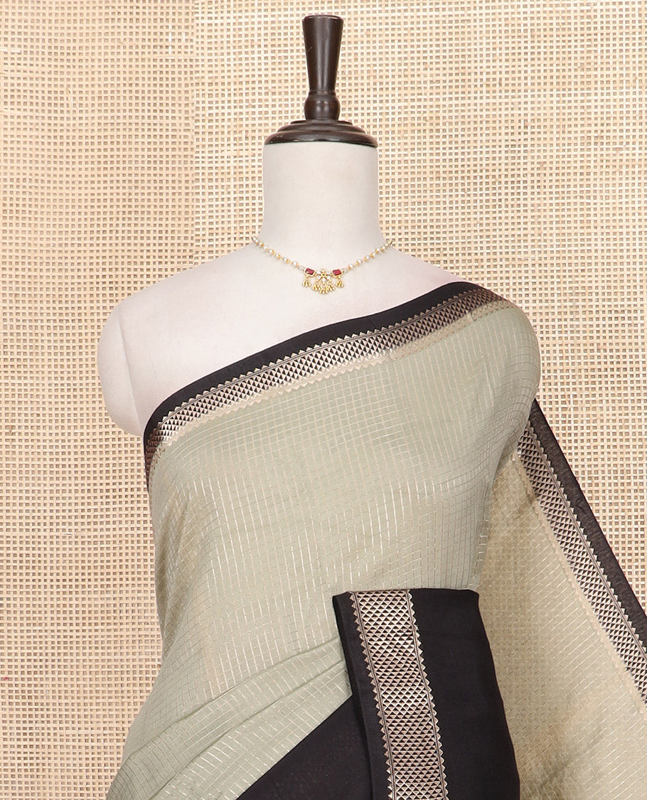 Light grey zari checked Assam silk saree, contrast traditional zari border of floral designs, and pallu of zari designs
