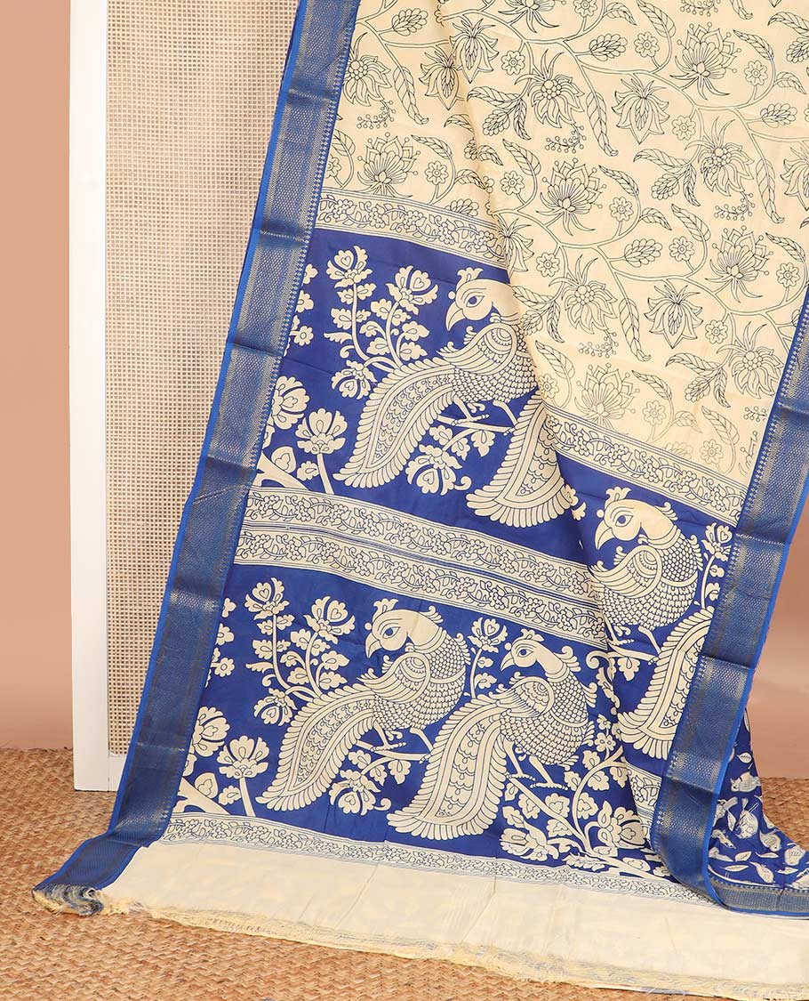 Light sandal floral vine machine printed kalamkari cotton saree, contrast traditional zari border, and pallu of peacock motifs