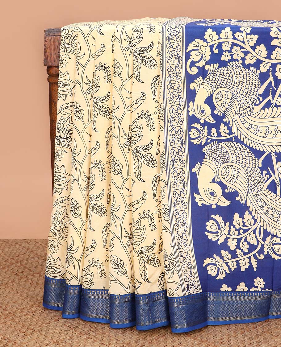 Light sandal floral vine machine printed kalamkari cotton saree, contrast traditional zari border, and pallu of peacock motifs