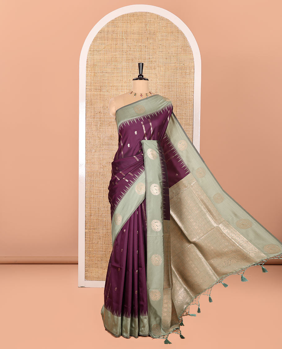 Purple Elite Soft Silk Saree, Elevated with Zari Buttas and Zari Stripes All Over Its Body, Complemented by a Contrast Temple Border of Round Peacock Designs, Rich Pallu of Peacock Chakram Butta Enclosed Checks, and Paired with a Contrast Blouse