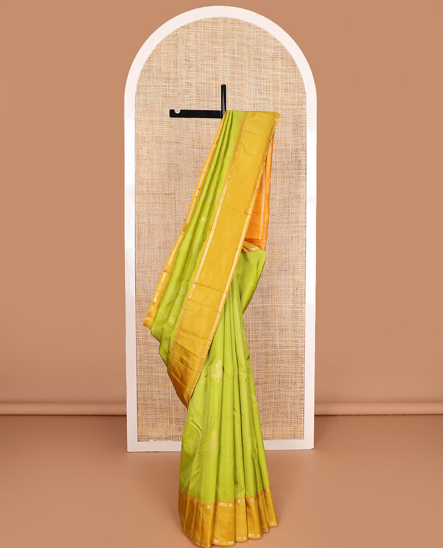 Parrot green zari design Vasundhara silk mix saree, contrast rettai pettu border of muthu designs, and jaal pallu