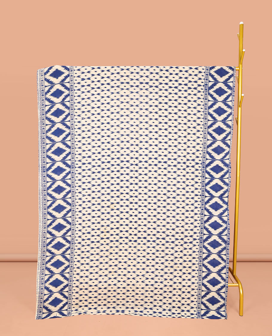 Blue and Off-White Machine-Printed Kalamkari Cotton Saree, Steeped with Buttas on Its Body, Subtle Ikkat Geometric Printed Border, Pallu of Peacock Print, and Paired with a Printed Blouse