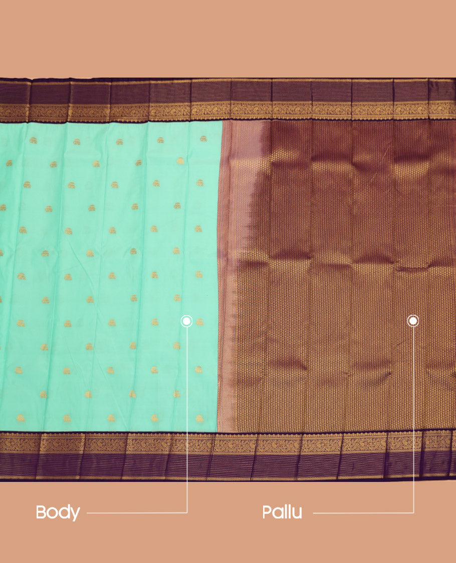 Turquoise Budget Silk Saree, Highlighted with Elephant Buttas All Over Its Body, Complemented by a Contrast Traditional Zari Design Border of Peacocks, Artfully Woven Pallu of Jaal Designs, and Paired with a Contrast Blouse