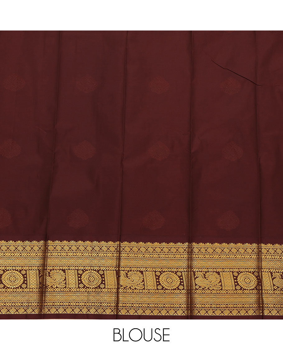 Orange Budget Silk Saree, Beautifully Bedecked with Zari Buttas All Over Its Body, Complemented by Contrast Traditional Border of Peacock-Chakram Designs, Intricate Jaal Pallu, and Paired with a Contrast Blouse