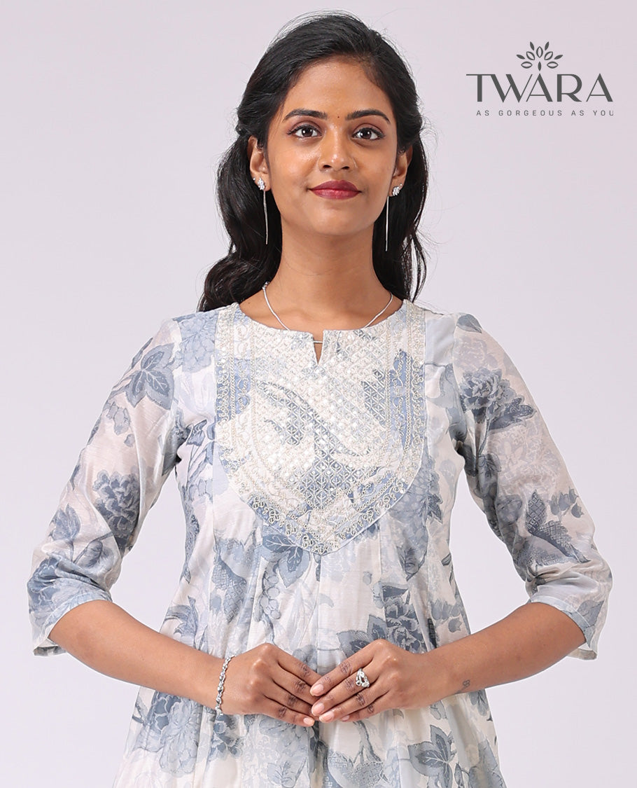 Twara cream floral print , embroidered round neck, 3/4 th sleeve , below knee lenght a-line kurti