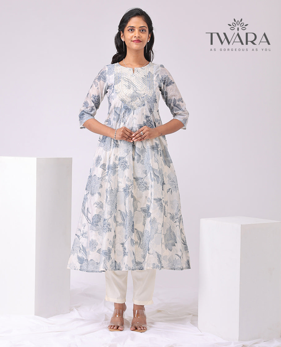 Twara cream floral print , embroidered round neck, 3/4 th sleeve , below knee lenght a-line kurti