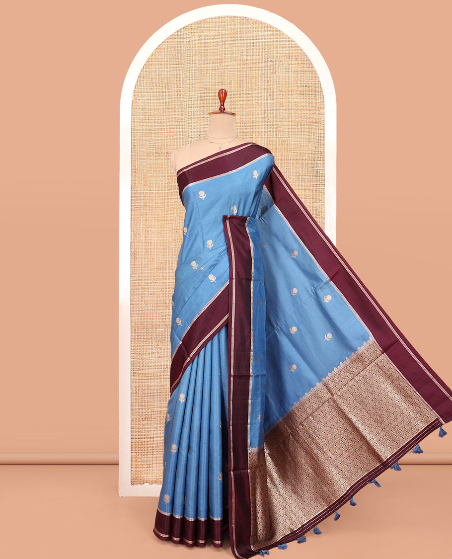 Blue Satin Silk Saree, Mesmerized with Floral Buttas All Over Its Body, Complemented by a Contrast Rettai Pettu Traditional Zari Border, Beautifully Zari Bedecked Pallu, and Paired with a Contrast Blouse