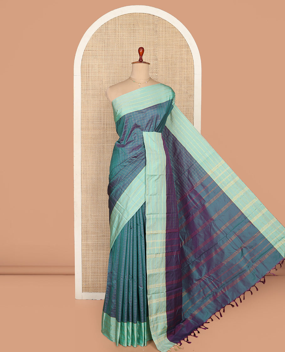 Blue Aarani Silk Saree, Dazzled with Butta Enclosed Checked Design on Its Body, Complemented by a Contrast Zari Striped Border, Pallu of Butta Enclosed Checks, and Paired with a Matching Blouse