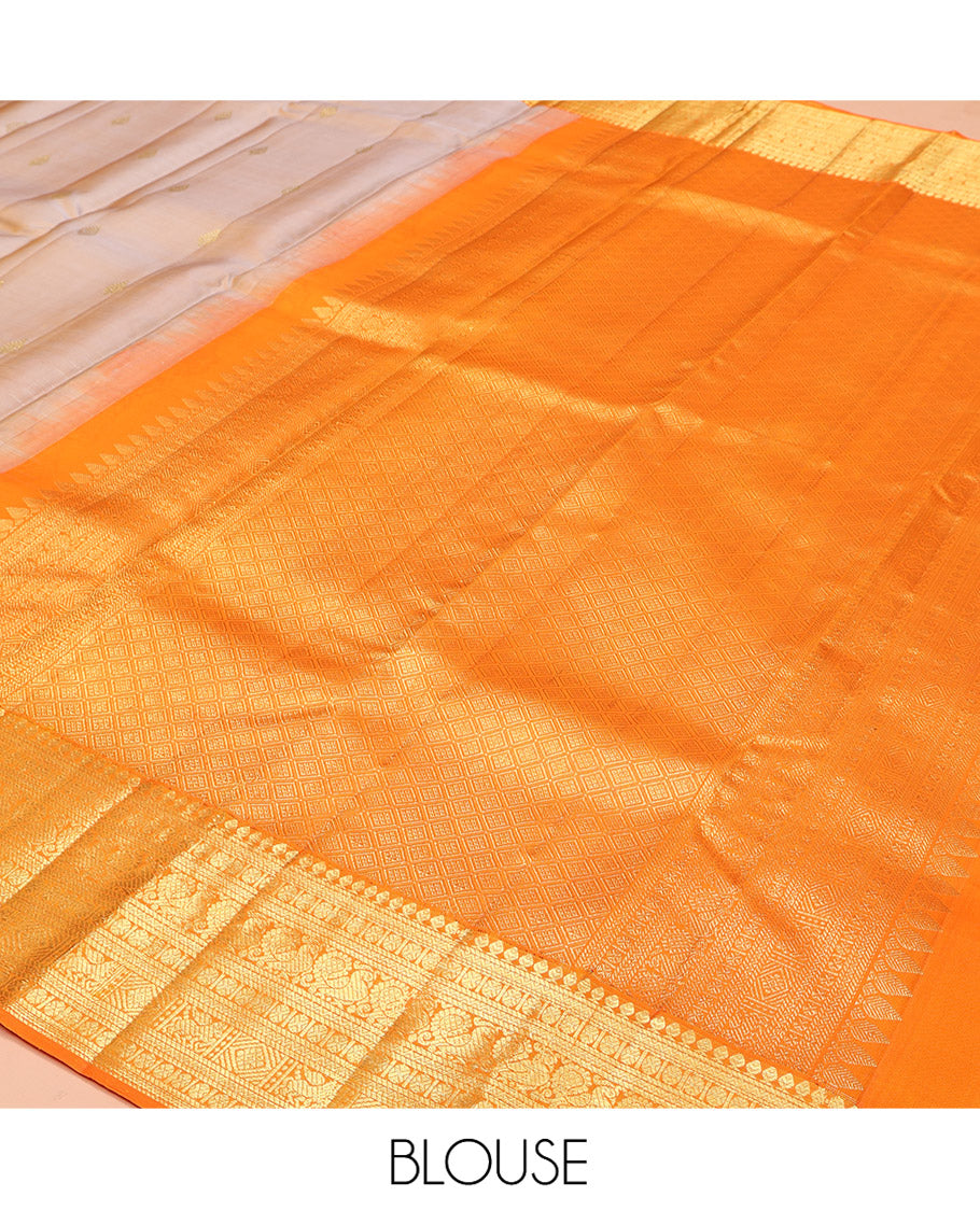 Sandal Kanchipuram Silk Saree, Finely Crafted with Zari Buttas All Over Its Body, Complemented by a Contrast Border of Thilakam Mokku, Poun, Neli, Mayil, and Kuthirai Designs, Pallu of Jaal Designs, and Paired with a Contrast Blouse