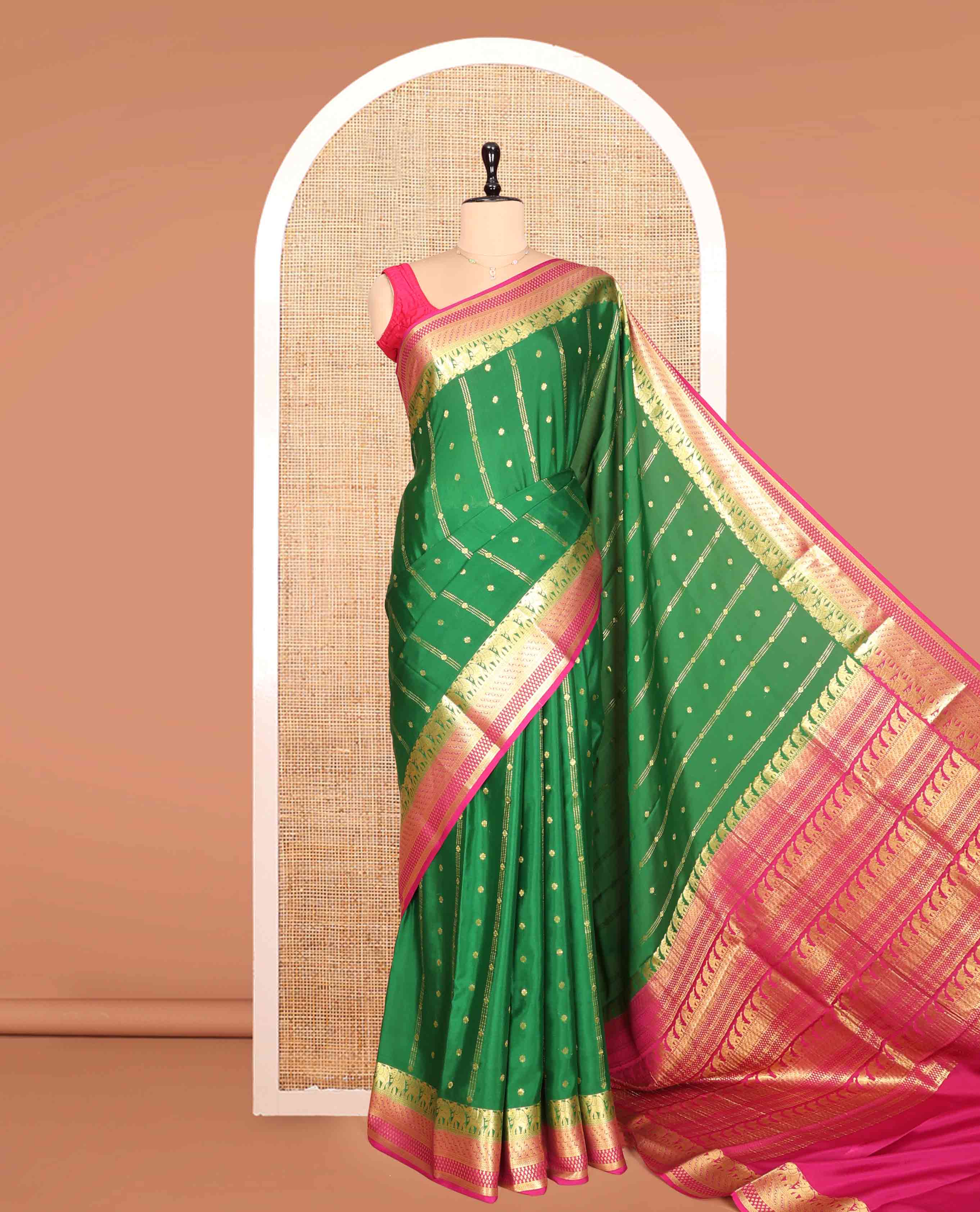 Green Mysore Silk Saree, Artfully Detailed with Zari Buttas and Stripes, a Contrast Traditional Zari Border, Intricately Designed Pallu, and a Contrast Blouse