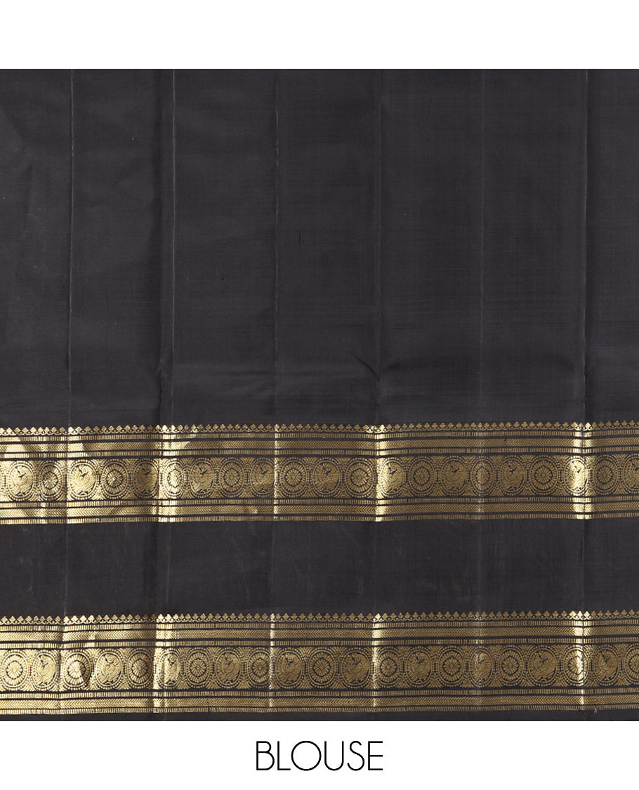Green Kanchipuram Silk Saree, Ornamented with Zari Buttas All Over Its Body, Complemented by a Contrast Rettai Pettu Border of Salngai, Muthu, Kathir, Chakram, and Round Mayil Designs, Grand Pallu, and Paired with a Contrast Blouse