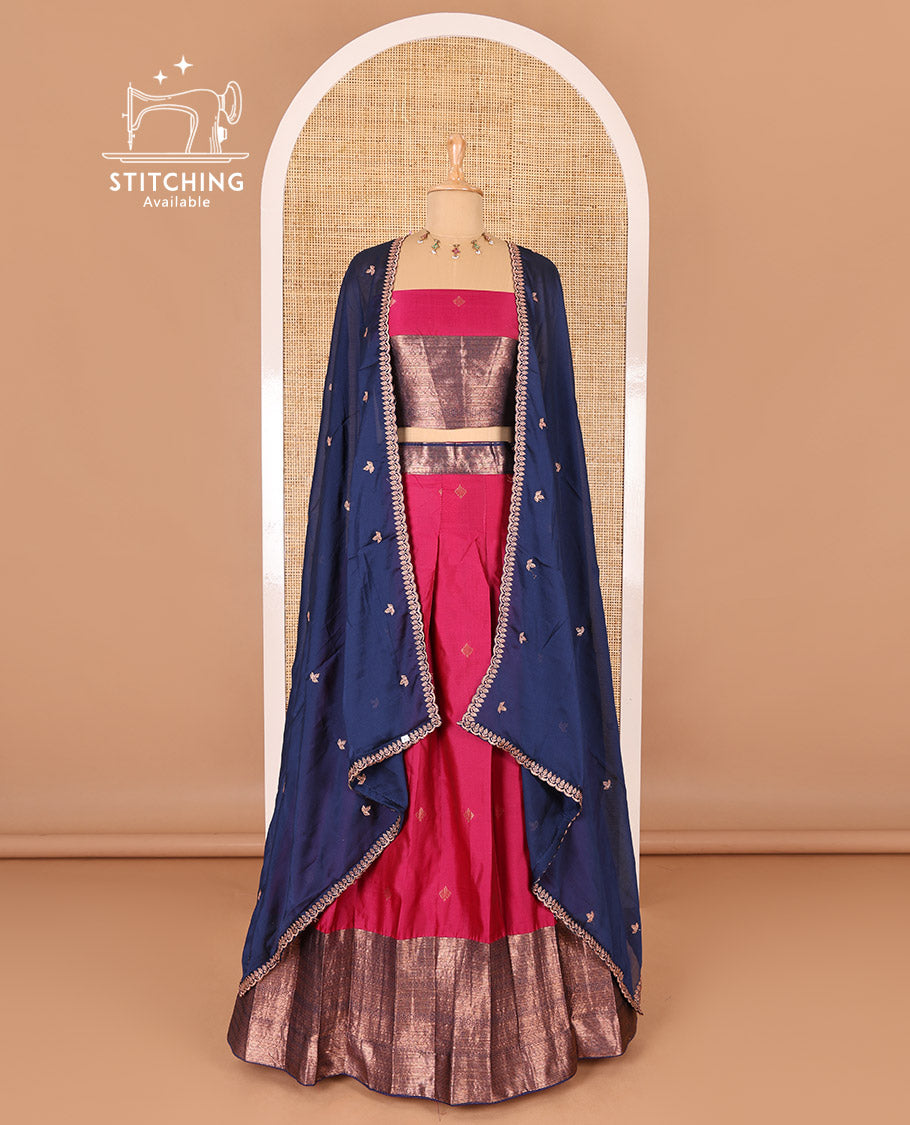 Rani pink taffeta silk half-saree, zari buttas and contrast traditional zari bordered skirt, a matching taffeta silk blouse, and contrast embroidered satin georgette dhavani