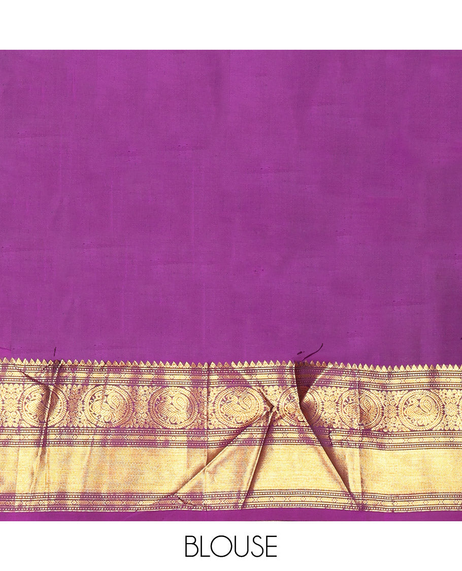 Parrot Green Vasundhara Silk Saree, Enriched with Sparse Stripes and Zari Buttas, Complemented by a Contrast Border of Thilakam, Banaras, Muthu, and Round Mayil Designs, Pallu Steeped with Traditional Designs, and Paired with a Contrast Blouse