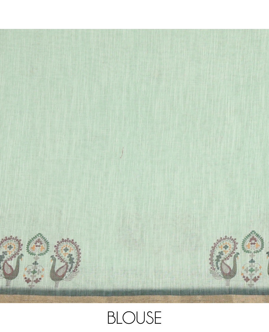 Green buttas with mirror work linen saree, zari border with peacock motifs print, printed mirror work pallu, and matching blouse