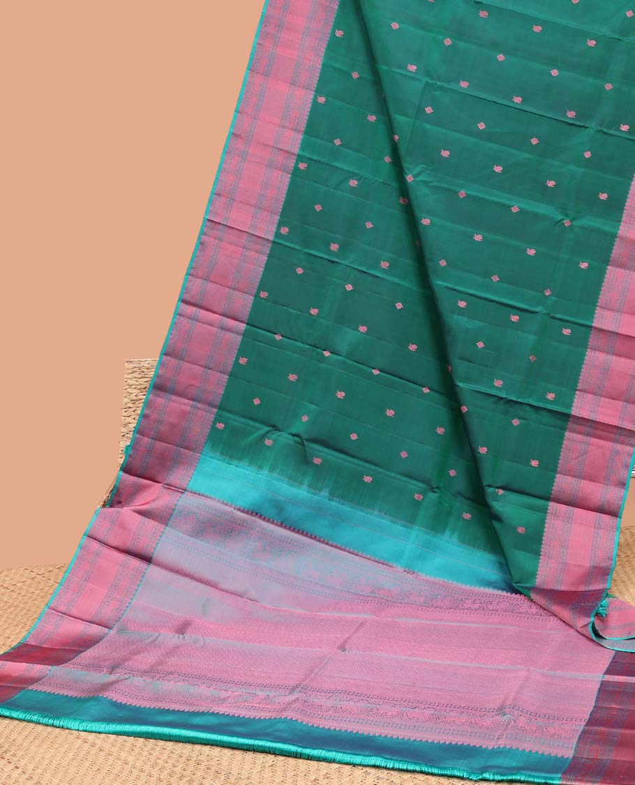 Green floral buttas kancheepuram silk saree with contrast border of thilakam mokku, muthu, paun, banaras design & zari design pallu