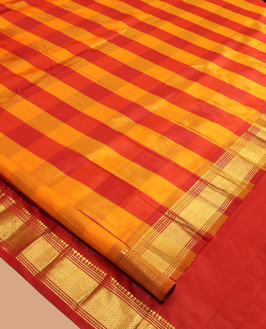 Red-Orange Kanchipuram Silk Saree, Graced with Checks, a Zari One-Sided Border of Panneer Sombu, Banaras, Muthu, and Mayil Kann Design, Zari Design Pallu, and No Blouse