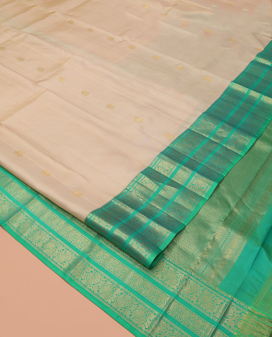 Sandal Vasundhara Silk Saree, Woven with Zari Buttas All Over Its Body, Complemented by a Contrast Border of Jada Nagam, and Kodi Visiry Designs, Intricately Designed Pallu, and Paired with a Contrast Blouse