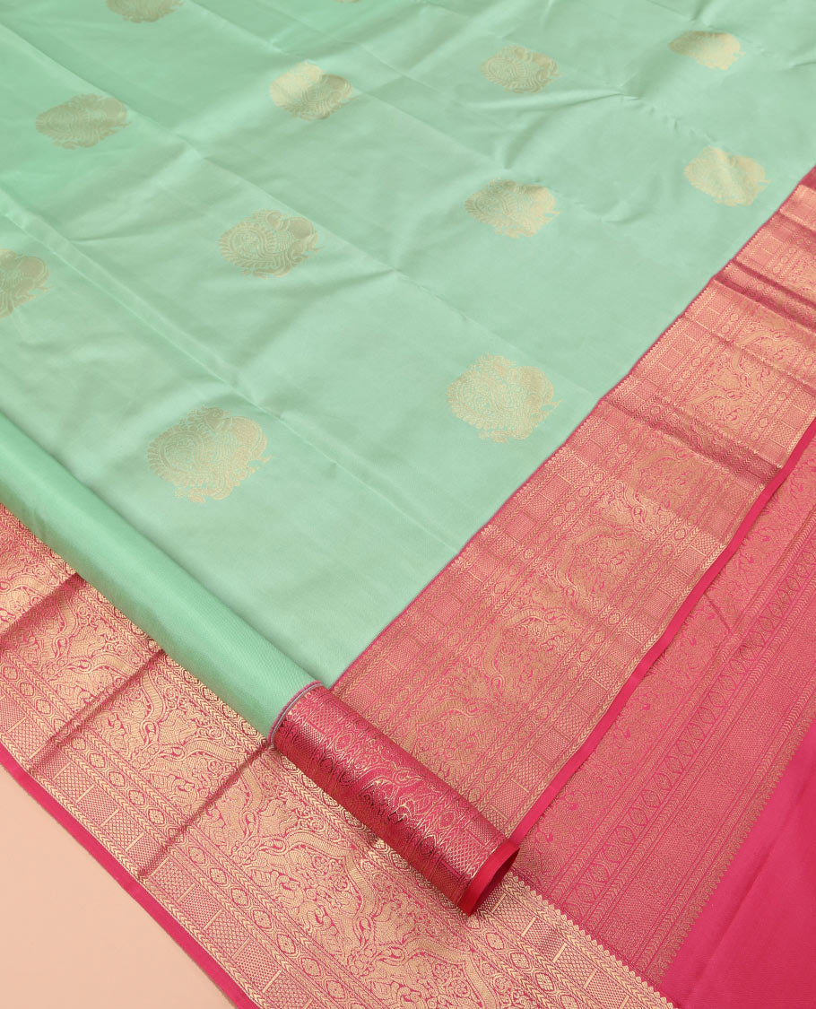 Green Vasundhara Silk Saree, Delicately Woven with Zari Buttas, Contrast Border of Thilakam, Kathir, Mayil Kann, Cross Kamalam, and Yaali Designs, Grand Pallu, and Contrast Blouse
