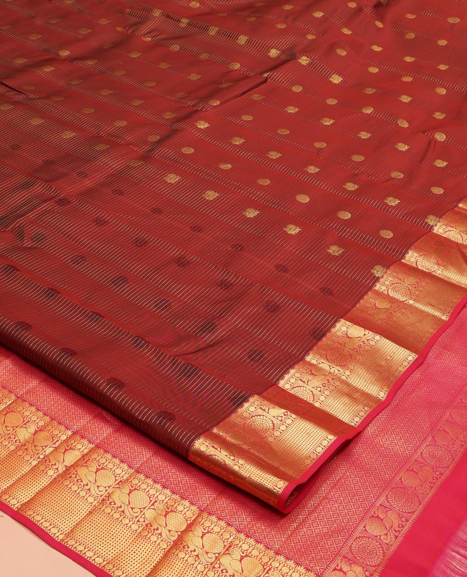 Maroon Vasundhara Lite Silk Mix Saree, Mesmerized with Annam-Chakram Butts and Stripes on Its Body, Complemented by Contrast Border of Thazampoo Rekku, Muthu, Rudraskham, Mayil, and Muthu Designs, Grand Jaal Pallu, and Paired with a Contrast Blouse