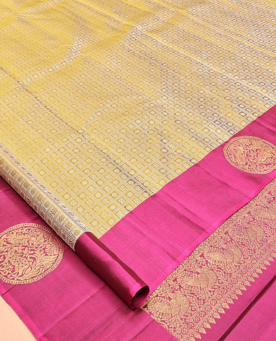 Green Embossed Parambara Silk Saree, a Contrast Border of Chakram Designs, Grand Pallu of Jaal Design, and Contrast Blouse
