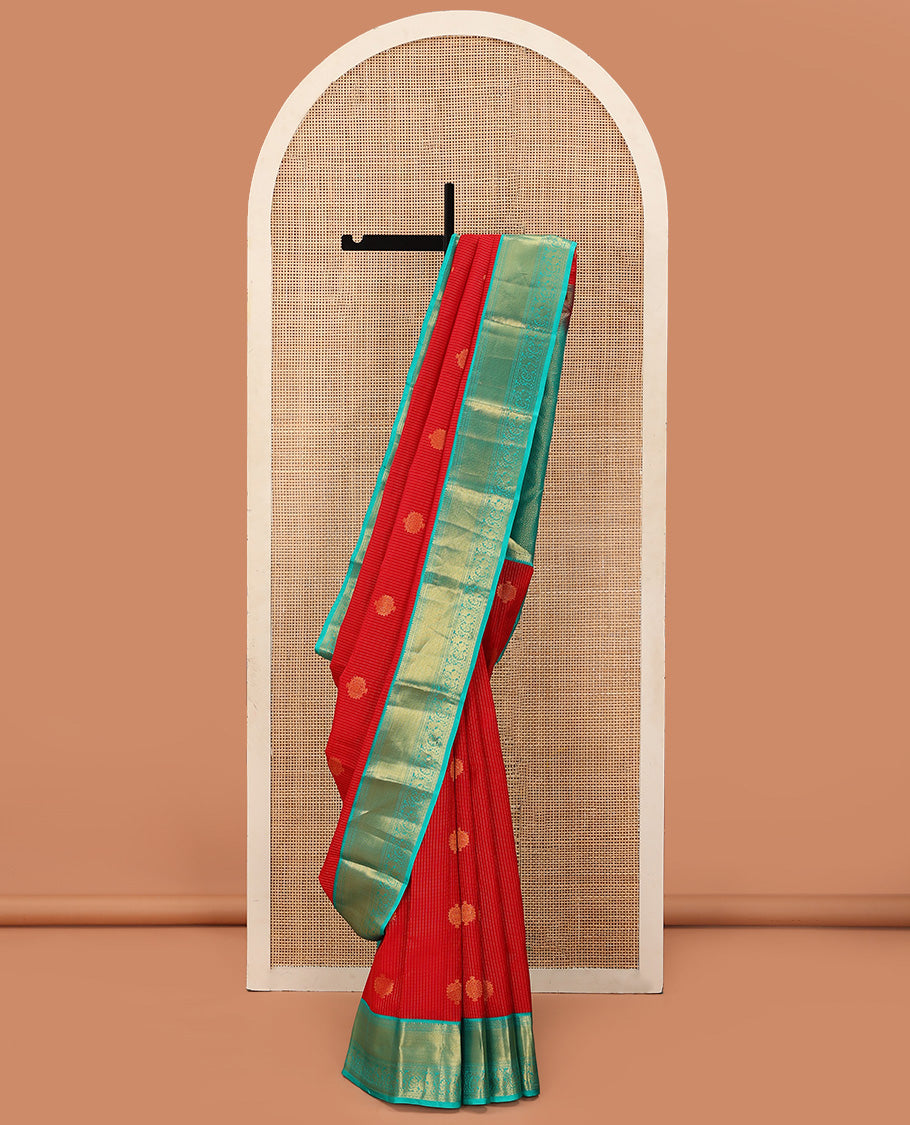 Red Vasundhara Lite Silk Mix Saree Gracefully Embellished with Zari Buttas and Stripes, Complemented with a Contrast Border Featuring Rekku, Banaras, Neli, Mayil Kann, Kodi Visiry, and Mayil Designs, Intricately Decked Up Pallu, and a Contrast Blouse
