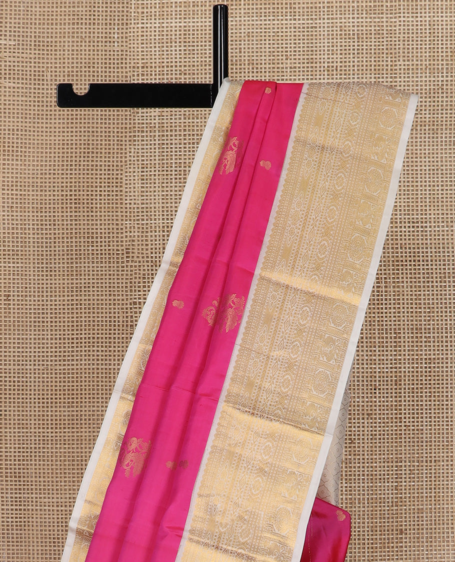 Pink zari buttas silk saree, contrast border of thilakam, diamond, laddu kamalam, muthu, kathir, mayil and chakram designs, and jaal pallu