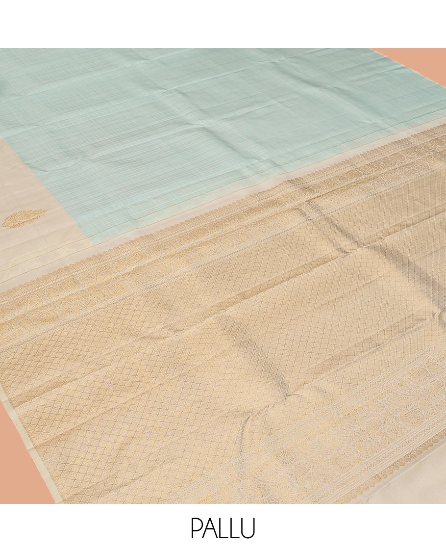Pale Blue Kanchipuram Silk Saree, Sparsely Woven with Checks, Complemented by a Contrast Zari Buttas Woven Border, Jaal Pallu, and Contrast Blouse