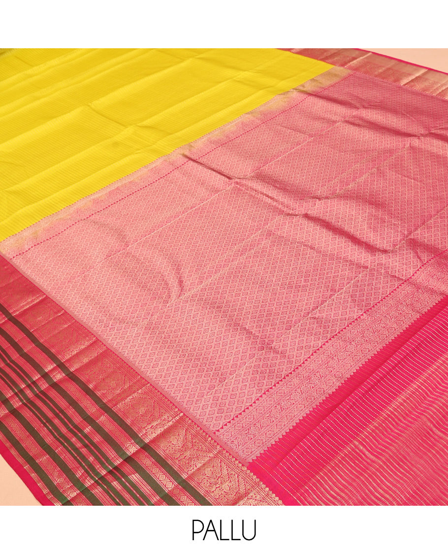Yellow Vasundhara Silk Saree Adorned with Muthu Stripes All Over Its Body, Contrast Border of Thilakam Mokku, Muthu, Banaras, Mayil, Kamalam, and Neli Designs, Intricate Pallu, and Paired with a Contrast Blouse