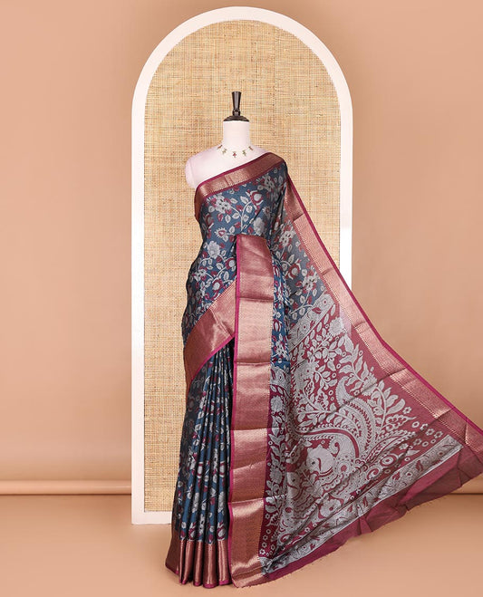 Navy blue kalamkari floral vine and peacock printed dola silk saree, contrast traditional zari border, peacock printed pallu, and floral vine print blouse