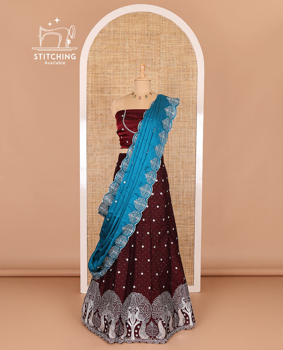 Wine half-saree, buttas, tree, and peacock motifs embroidered semi-taffeta silk top, matching blouse, and contrast scallop embroidered dhavani