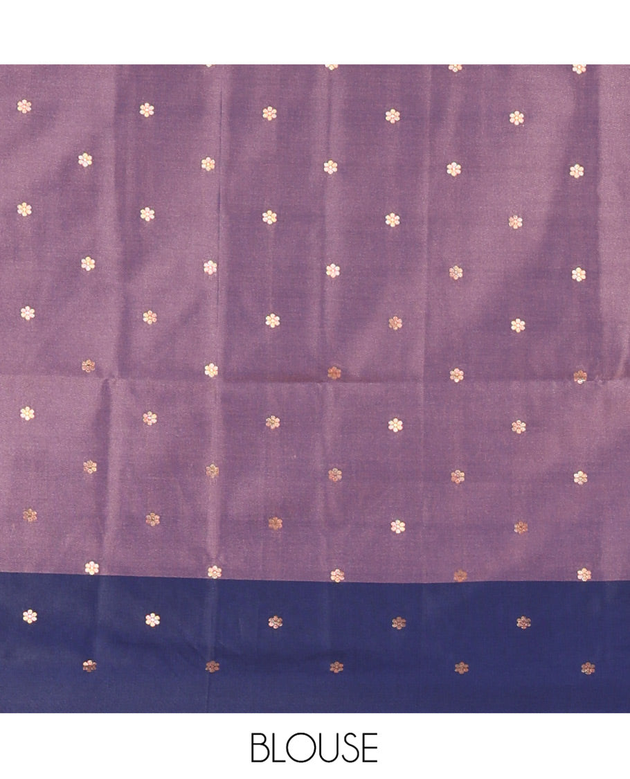 Lavender Soft Silk Saree, Elevated With Zari Buttas All Over Its Body, Complemented by Captivating Contrast Border of Elephant Motifs, Grandly Decked Up Pallu, and Paired with a Contrast Blouse
