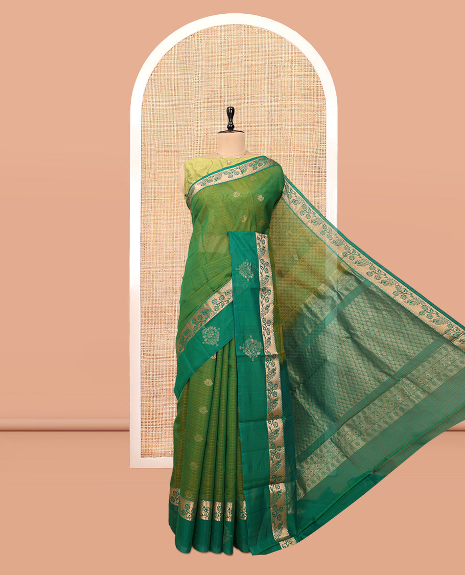Green Silk Cotton Saree, Ornamented with Zari Buttas, a Contrast Floral Creeper Border, Jaal Pallu, and a Contrast Blouse