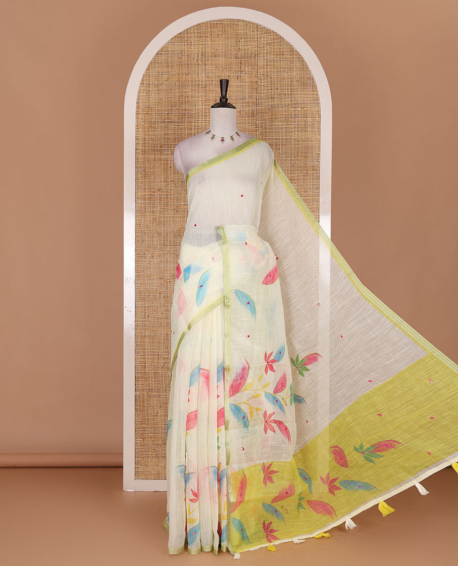 Light green colorful floral vine printed with mirror embroidered linen saree, contrast zari piping border, and contrast printed blouse