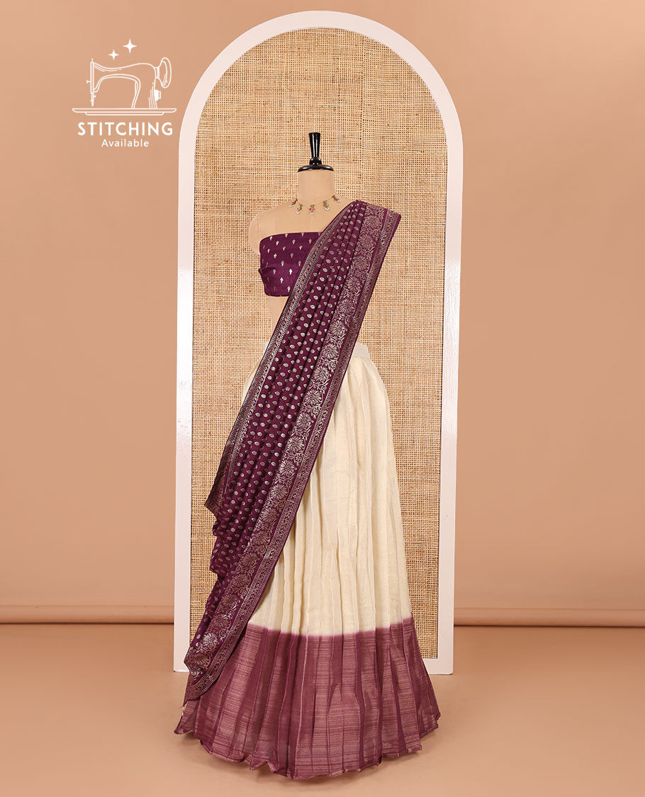 Cream-wine Vichitra half-saree, plain and contrast bordered skirt, contrast leaf buttas blouse, dhavani of buttas and floral creeper designs