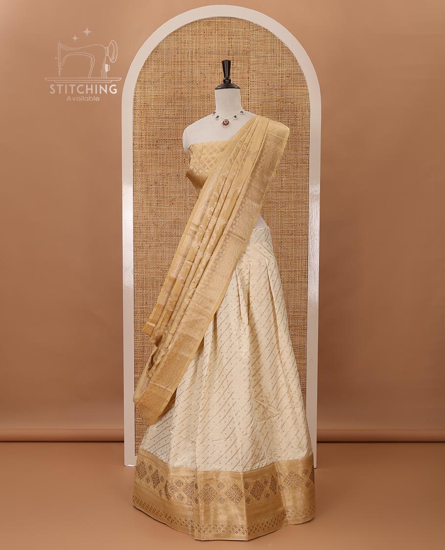 Cream semi-banaras material chudidar,leheriya zari skirt,contrast gold-color zari & swarovski stonework border,jacquard blouse & zari weave dhavani