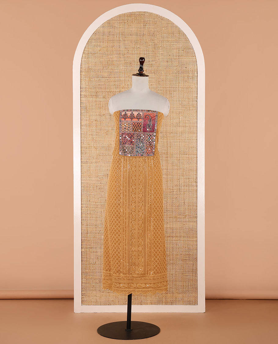 Mustard churidar material set, Ajrakh-printed neck with Schiffli embroidery & mirror work georgette top, kalidoscopic-colored dupatta of ajrakh print & mirror embroidery & plain crepe bottom
