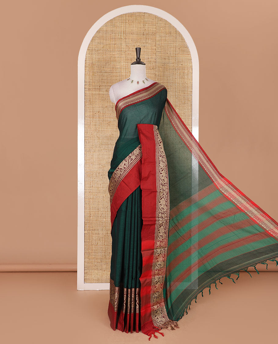 Green plain mercerised cotton saree, contrast traditional border of peacock, and elephant motifs, striped pallu, and a matching blouse
