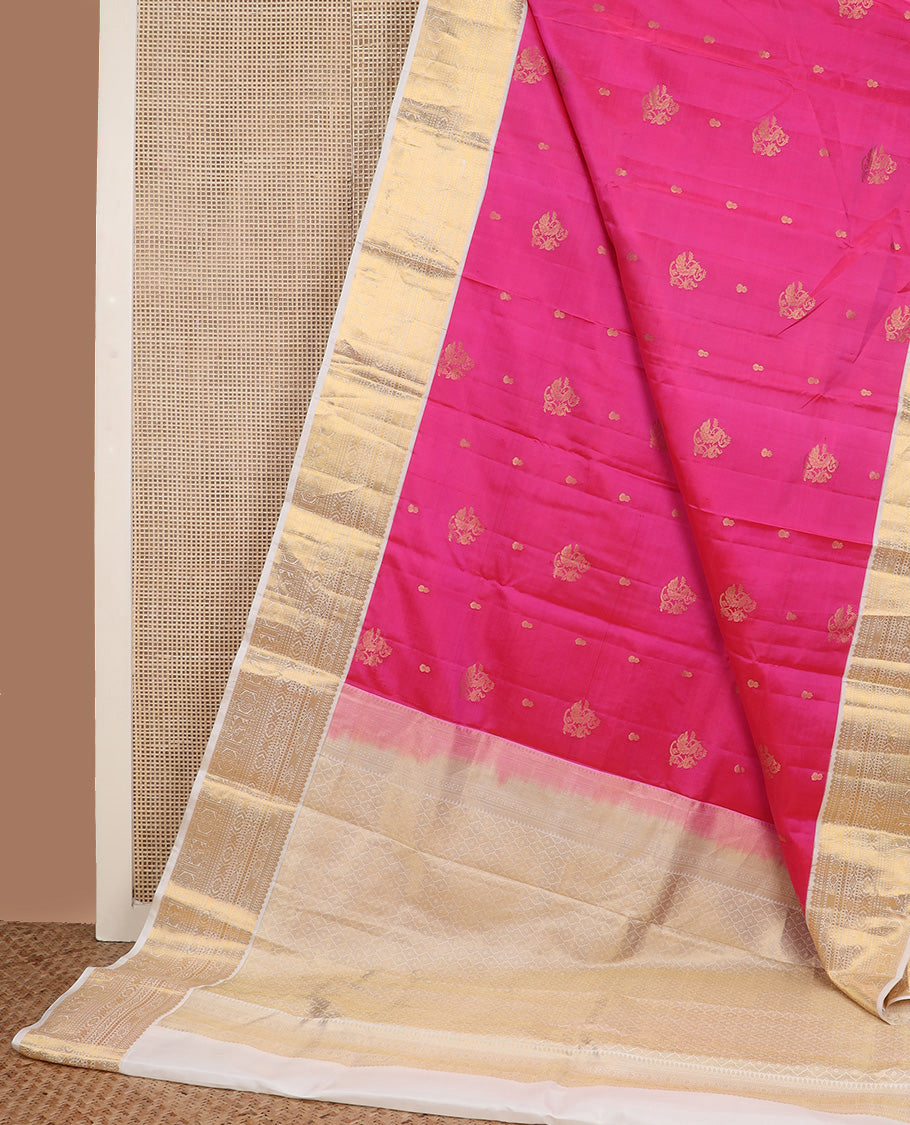 Pink zari buttas silk saree, contrast border of thilakam, diamond, laddu kamalam, muthu, kathir, mayil and chakram designs, and jaal pallu