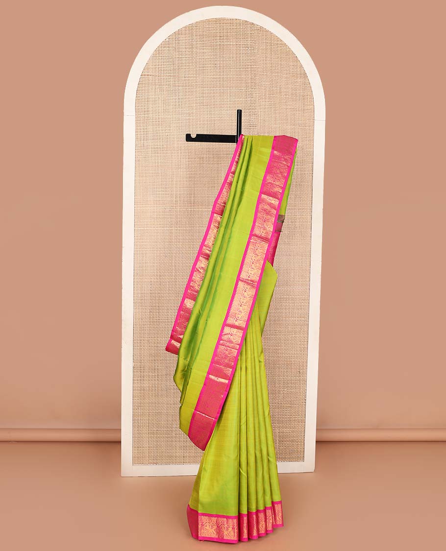 Green plain Kanchipuram korvai silk saree, contrast neer korvai border of thilakam mokku, kathir, poun, and mayil kann designs, and jaal pallu