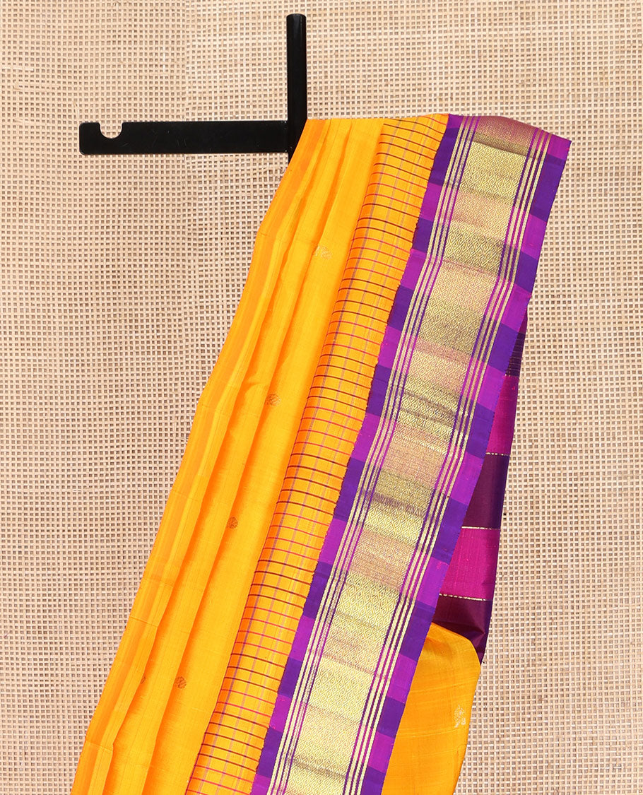 Yellow Kanchipuram Silk Saree, Bedecked with Zari Buttas on Its Body, Complemented by Contrast One-Sided Korvai Border of Banaras, and Mayil Kann Designs, Pallu Features Zari Designs, and Comes Without a Blouse
