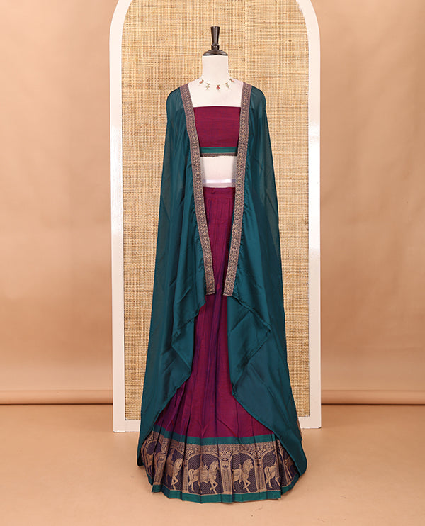 Magenta with green mercedised cotton half-saree, contrast elephant zari border skirt, matching blouse & one side border georgette dhavani