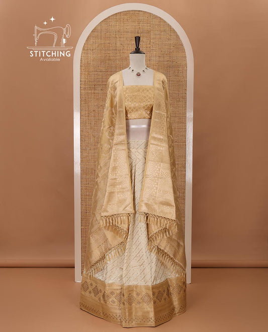 Cream semi-banaras material chudidar,leheriya zari skirt,contrast gold-color zari & swarovski stonework border,jacquard blouse & zari weave dhavani