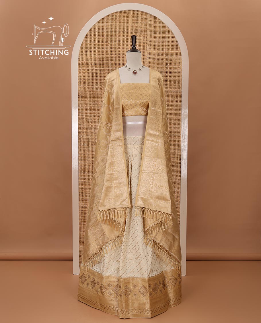 Cream semi-banaras material chudidar,leheriya zari skirt,contrast gold-color zari & swarovski stonework border,jacquard blouse & zari weave dhavani