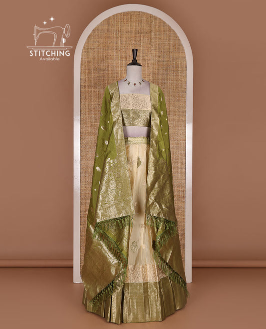 Cream taffeta silk half saree, meena buttas skirt, contrast mehendi green  traditional zari border, matching blouse, and zari woven dhavani